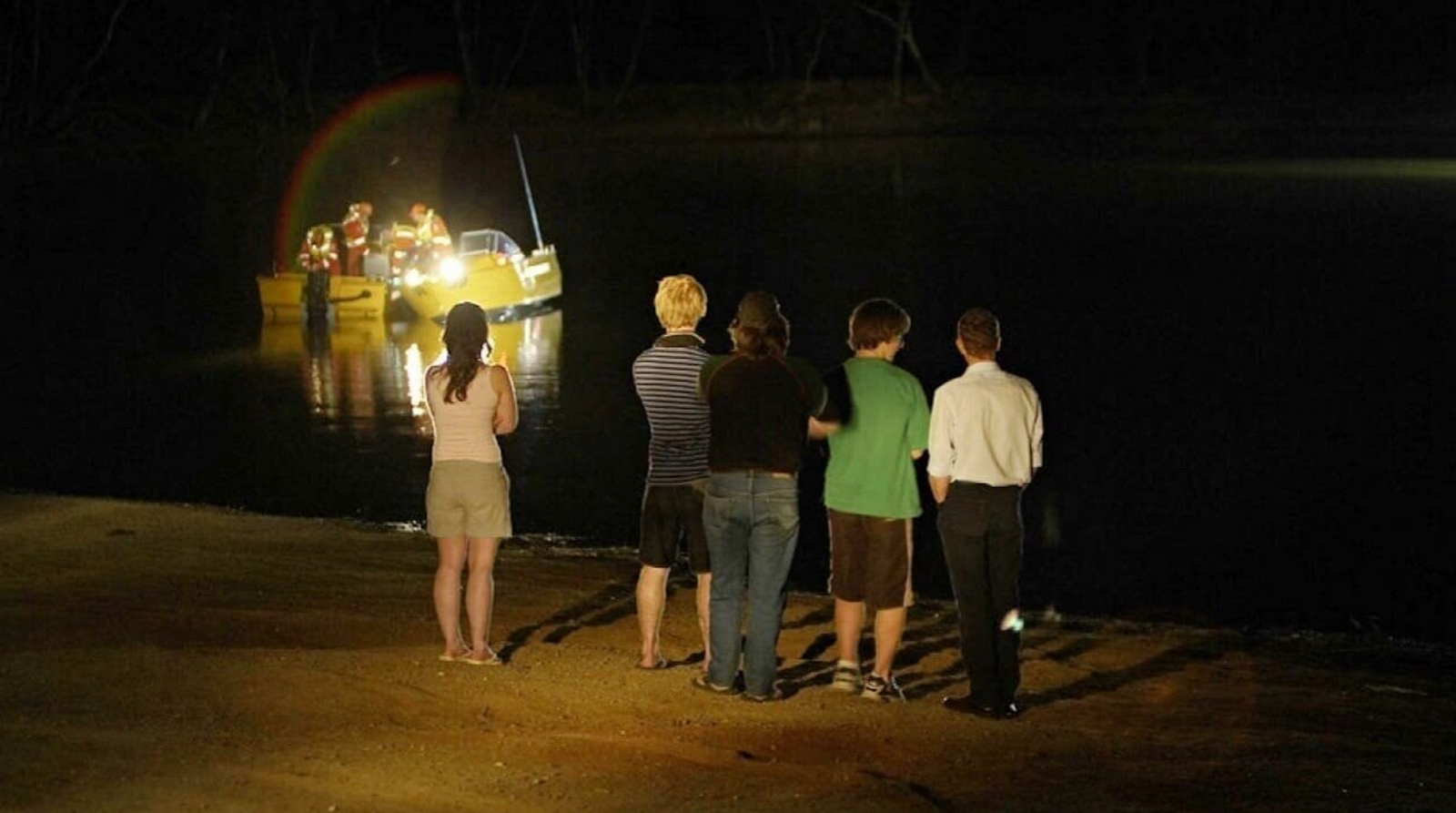 A scene from Lake Mungo showing characters staring out at the lake at night, featured in GoreCulture’s list of psychological horror movies.